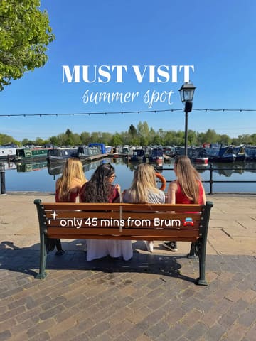 A bright, sunny, and inviting lifestyle shot featuring four people sitting on a bench overlooking a marina. The composition is symmetrical and clean, effectively showcasing the scenic, relaxing atmosphere of the location. The text overlay clearly communicates the value proposition and the location's accessibility, making it an effective piece of travel and lifestyle marketing content.