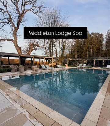A serene, symmetrical shot of the outdoor swimming pool at Middleton Lodge Spa during twilight. The image effectively captures the tranquil and upscale atmosphere of the venue, using natural light to create an inviting mood.