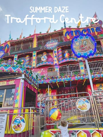 A photo of a colourful funhouse ride at the Summer Daze event at the Trafford Centre, featuring a child looking up at the structure.