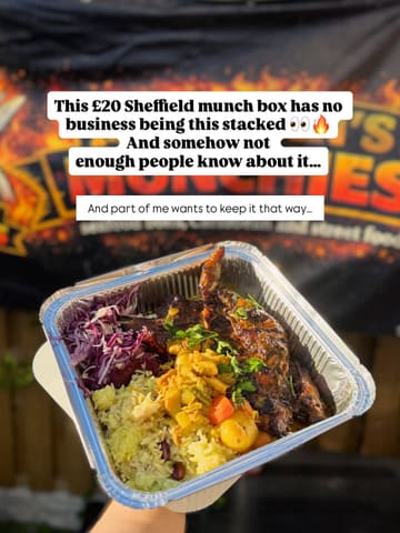 A casual, handheld shot of a Caribbean takeaway meal in a foil container, held in front of a branded banner. The image is clearly intended for social media promotion, focusing on the portion size and the 'munch box' concept.