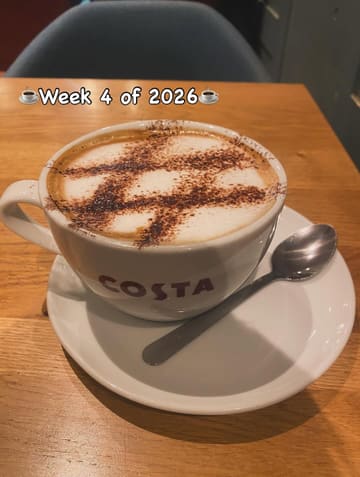 A simple, casual shot of a cappuccino in a Costa Coffee cup on a wooden table, likely part of a weekly food diary.