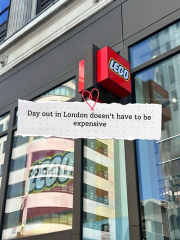 A photo of the exterior of the LEGO store in London, featuring a text overlay about affordable days out. The image captures the store signage but is heavily impacted by reflections of the surrounding buildings on the glass facade.
