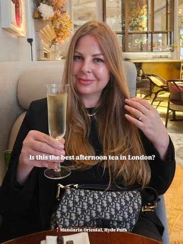 A polished, high-quality shot of a creator enjoying an afternoon tea experience at the Mandarin Oriental, Hyde Park. The image is well-composed, bright, and effectively captures the luxurious atmosphere of the venue.