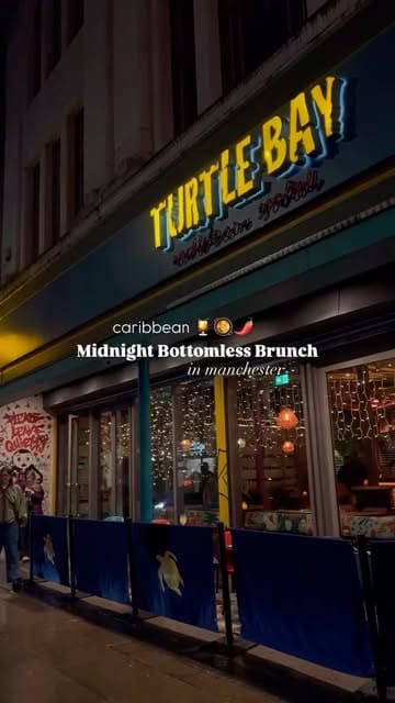 A night-time exterior shot of the Turtle Bay restaurant in Manchester, used to promote their 'Midnight Bottomless Brunch' offering.