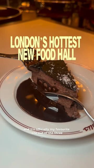 A couple visits the Arcade food hall in Covent Garden, showcasing various dishes including pizza, fried chicken, a burger, and chocolate cake, while highlighting the lively atmosphere and DJ.