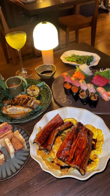 A review of a new Japanese restaurant in Shoreditch, showcasing various dishes including wagyu sando, sushi, grilled unagi, and matcha tiramisu, as well as the interior and upcoming karaoke facilities.