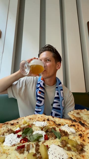 A promotional video for Rudy's Pizza featuring a limited-edition football scarf collaboration with Poretti beer, offering a free pint to diners who wear the scarf.