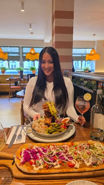 A video review of Gallio restaurant in London, featuring a variety of Mediterranean-inspired dishes including skewers, prawns, croquetas, and flatbreads. The creator showcases the interior and the dining experience with family.