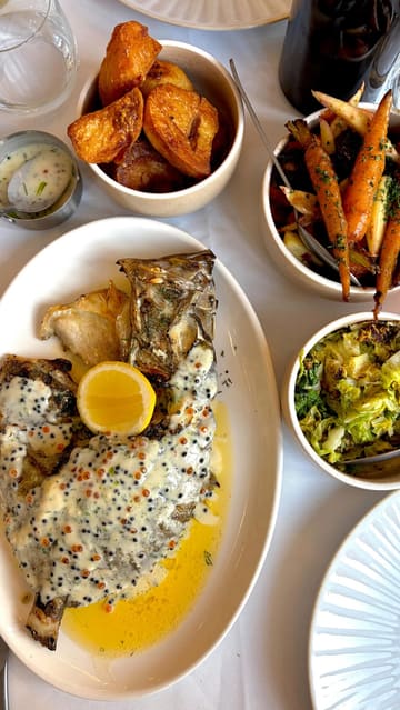A visually appealing montage showcasing a high-end dining experience at Orion by Alex Webb. The video features a variety of dishes including seafood, a Sunday roast, and an impressive dessert trolley, alongside glimpses of the restaurant's interior and service.