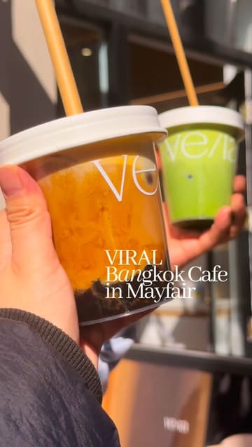 A short, aesthetic reel showcasing the opening of a new Bangkok-inspired cafe in Mayfair, London. The video features the creator visiting the venue, displaying the interior, and highlighting their signature matcha and boba latte drinks with text overlays providing context.