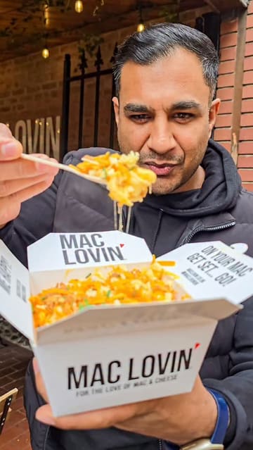 A fast-paced, engaging vlog-style review of Mac Lovin in Leicester. The video features the creator and his mother trying different mac and cheese dishes, including the 'Crispy Chick' and 'Super Cheez Classic'. It includes behind-the-scenes footage of the food preparation, showing fresh ingredients and the cooking process, followed by shots of the final product and the venue's exterior.