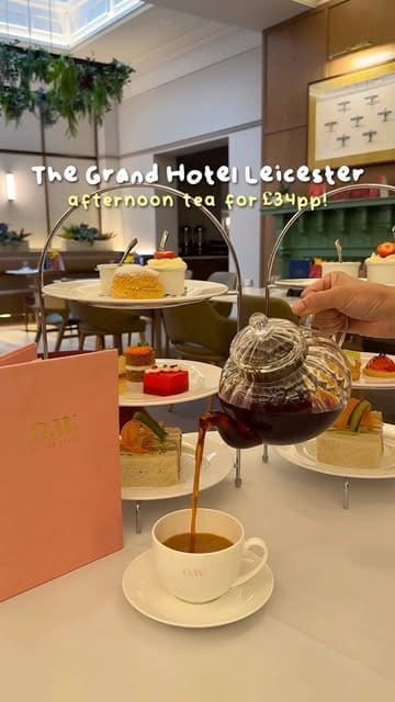 A short, polished montage showcasing an afternoon tea service at O.W. Restaurant within The Grand Hotel Leicester, featuring close-ups of the tea, scones, sandwiches, and patisserie, alongside shots of the elegant interior.