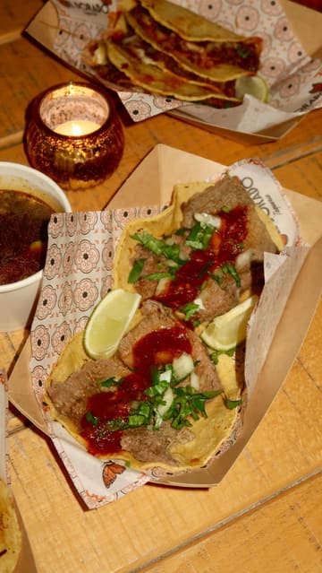 A short, fast-paced montage showcasing a Mexican street food pop-up called El Dorado Taqueria hosted at The Newport Inn. The video features close-ups of tacos being prepared on a griddle, the venue's interior, and the final plated dishes.