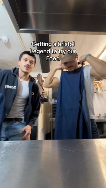 A behind-the-scenes video featuring the owners of a food venue hosting a local influencer to taste and review their dishes, including arancini, pasta, and tiramisu. The video focuses on the kitchen preparation and the direct feedback from the guest.