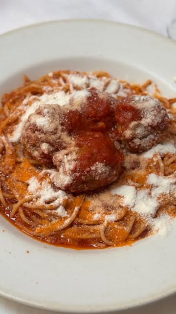 A vlog-style review of an old-school, family-run Italian restaurant in Bristol, highlighting the authentic food and the charming service from the owner.