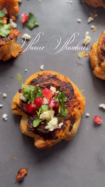 A recipe tutorial video demonstrating how to make paneer pinwheels using puff pastry and canned tomatoes.