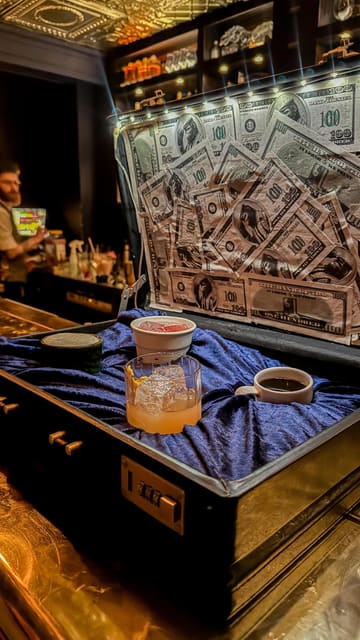 A promotional video for The Cabinet Club in Chester, showcasing their highly creative, film-themed cocktail menu. The video highlights the theatrical presentation of the drinks, including a Pulp Fiction-inspired cocktail flight served in a briefcase and a Jurassic Park-themed ice cream float, effectively selling the unique experience of the venue.