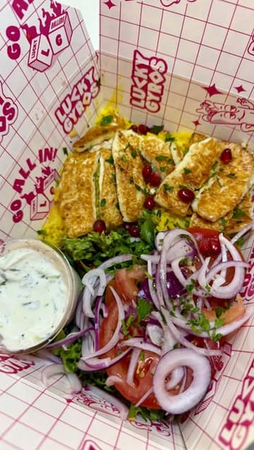 A creator visits Lucky Gyros, showcasing the menu, interior, and various dishes including chicken gyros, lamb kofta, halloumi rice bowl, and Greek fries.