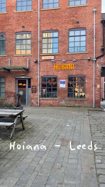 A short, casual review of Hoiana, a Vietnamese restaurant in Leeds. The video features shots of the restaurant's exterior and interior, a variety of dishes including a sharing platter and Pho, and the creators enjoying their meal.