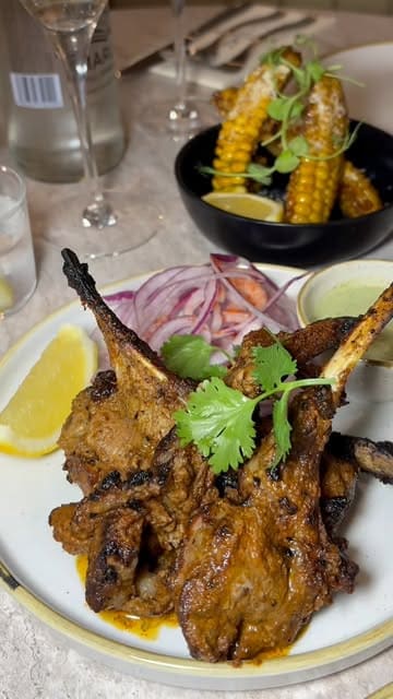 A montage showcasing the interior, menu, and various dishes at White Tiger, an Indian restaurant in Liverpool.