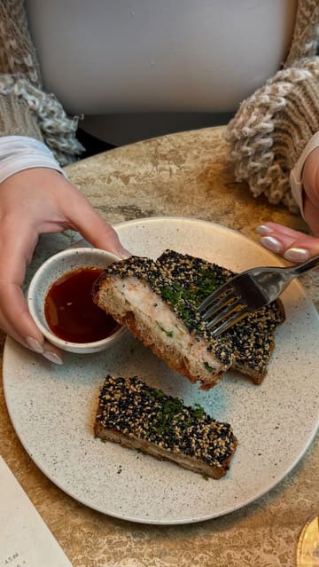 A London-based content creator documents a day of visiting various hospitality venues, including a bakery, an Australian-inspired restaurant, a pasta-making class, and a pizzeria. The video uses a fast-paced, vlog-style format to highlight the food, atmosphere, and experiences at each location.