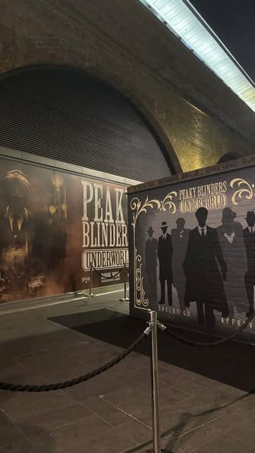 A promotional video showcasing the Peaky Blinders Underworld immersive experience in London, highlighting the set design, themed decor, and interactive elements like the horse racing game.