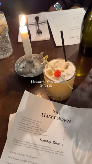 A montage of clips showcasing the village of Haworth, Yorkshire, including scenic views of the moors, local shops, and food from a local establishment.