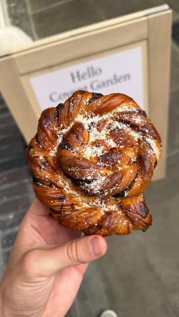 A promotional video for the new Sourdough Sophia bakery location in Covent Garden, featuring close-ups of various pastries, open sandwiches, and specialty lattes, alongside shots of the shop interior and exterior.