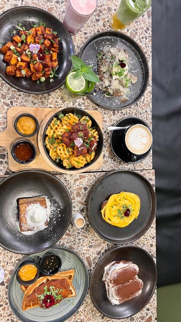 A fast-paced, energetic reel showcasing a variety of dishes and drinks at Milk & Egg, including waffles, scrambled eggs, truffle mushroom toast, Hong Kong French toast, Tiramisu, and specialty matcha/cloud drinks.