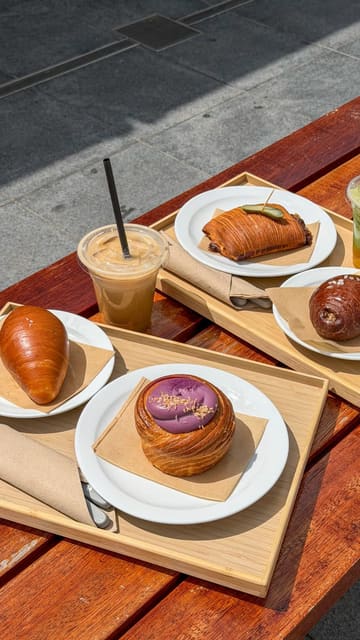 A promotional reel for a new London bakery, Rise & Fold, highlighting their fusion of European pastry techniques with Asian flavours, specifically showcasing their salt bread and various pastries, while promoting a limited-time £1 coffee/matcha deal.