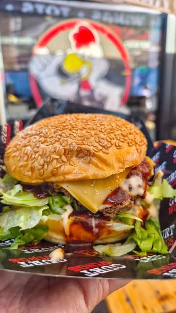 A short, fast-paced video showcasing various menu items from Gurt Wings, including cheese sticks, a chicken burger, and buffalo strips with tater tots.