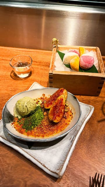 A montage of various dishes served at ROKA, a Japanese Robatayaki restaurant in Mayfair, London. The video features close-ups of grilled octopus, black cod, fillet steak, and a pistachio crème brûlée, alongside shots of the open kitchen and charcoal grill.