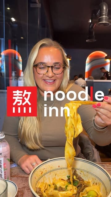 A vlog-style review of the newly opened Noodle Inn in Glasgow, showcasing their hand-pulled noodles, crispy duck buns, dumplings, and prawns.
