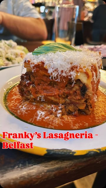 The video is a candid review of Franky's Lasagneria, located within The John Hewitt pub. The creator provides a critical assessment of the food, including lasagna, arancini, and chicken tenders, while also commenting on the service and the overall dining experience. The video uses a vlog-style format with voiceover commentary.