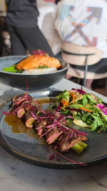 A review of 10Ten Bar & Bistro on Heaton Road, showcasing a selection of small plates, a salmon main, and a sticky toffee pudding dessert. The video features a voiceover describing the meal and the venue's atmosphere.