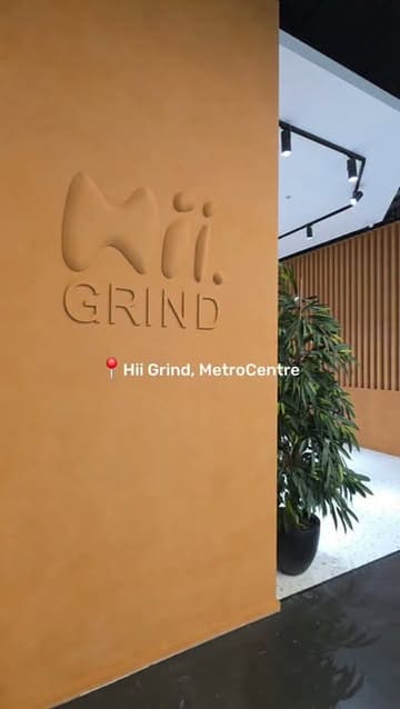 A short, aesthetic tour of the newly opened Hii Grind cafe located within a Flannels store at the Metrocentre. The video highlights the interior design, the coffee machines, a selection of pastries, and the branded cups, providing a quick look at the venue's atmosphere and menu offerings.