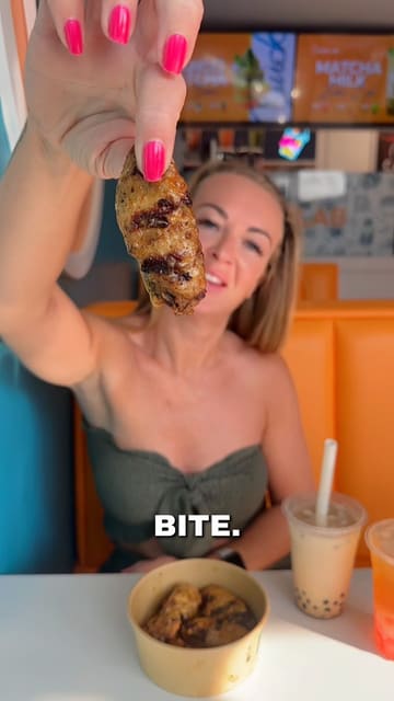 A creator visits the newly opened Captain Cluck in Waterloo, Liverpool, showcasing their menu of grilled chicken, rice bowls, wings, desserts, and boba tea.