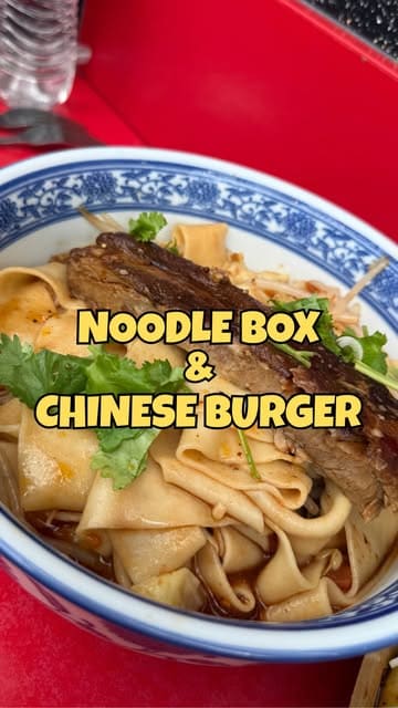 A creator visits Noodle Box & Chinese Burger in Newcastle's Grainger Market, showcasing their authentic Xi'an street food, including hand-pulled Biang Biang noodles and Chinese burgers.
