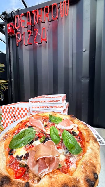 A short, energetic video showcasing a visit to Deathrow Pizza located within Attic Brew Co. The creator highlights the build-your-own pizza process, the menu, the casual atmosphere, and the accompanying drinks, providing a clear overview of the dining experience.