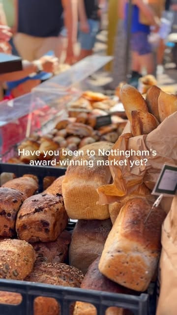 A montage showcasing various independent vendors at the Ruddington Village Market in Nottingham, featuring artisan breads, pastries, brownies, samosas, coffee, and handmade greeting cards.