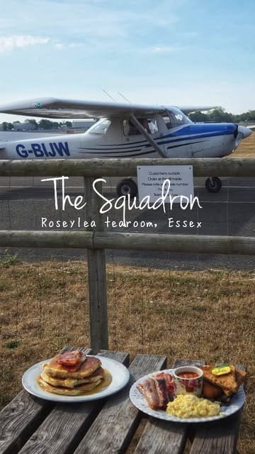 A short video showcasing a cafe located on an airfield in Essex, featuring shots of planes taking off and landing, the cafe interior, and breakfast dishes.