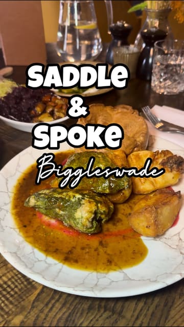 A review of a Sunday roast experience at Saddle & Spoke, featuring beef and chicken roasts, cauliflower cheese, cocktails, and dessert.