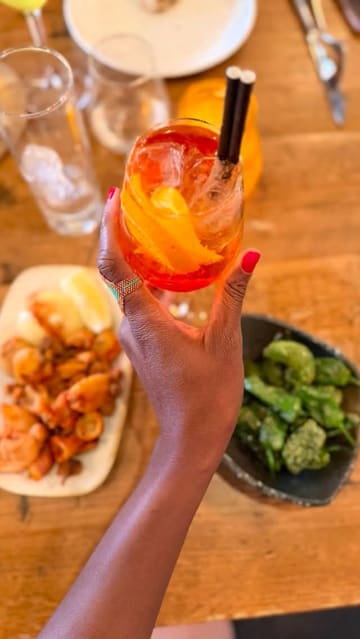 A creator visits Canto restaurant to review their 'Tipsy Tapas' bottomless brunch offer, showcasing the interior, various tapas dishes, and cocktails.