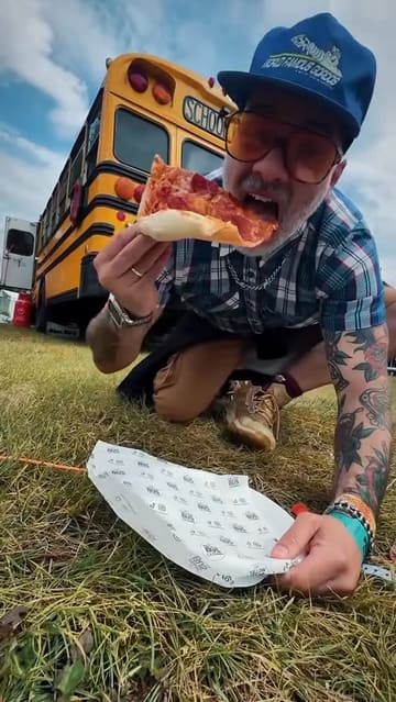 A high-energy vlog following a creator's experience at the Slam Dunk music festival, focusing on the various food vendors present. The video features quick cuts between the creator trying different dishes like pizza, loaded fries, ribs, dumplings, and fried chicken, interspersed with shots of the festival atmosphere and live music performances.