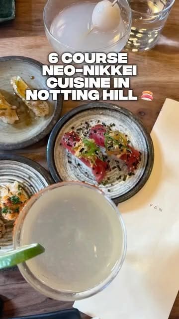 A creator visits a Nikkei fusion restaurant in Notting Hill, showcasing a variety of dishes from a six-course tasting menu, including tuna tiradito, crispy rice, and udon, alongside cocktails. The video highlights the intimate atmosphere and the quality of the food.