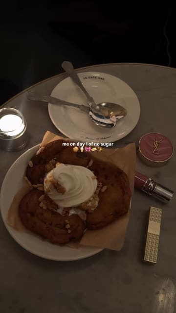 A short, aesthetic video montage featuring close-up shots of food items like cookies with ice cream, fish sliders, and a Caesar salad, interspersed with shots of the restaurant's interior and exterior. The video uses a slow, relaxed pace with music and minimal text overlays to highlight the dining experience at Le Cafe Nac in Belgravia.