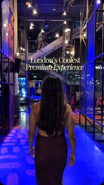 A short, atmospheric clip showcasing a walk through a premium lounge area at The O2, intended to highlight the exclusive nature of the experience. The lighting is moody and neon-heavy, fitting the venue's aesthetic, but the technical quality suffers from low-light noise and a lack of sharp focus on the subject.