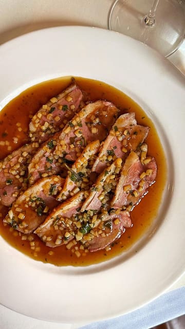 A short, high-quality montage showcasing various dishes at a Michelin-listed restaurant in Manchester, focusing on the presentation and texture of the food.