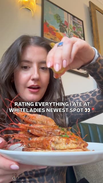 A creator visits 'Crave' in Bristol, reviewing a variety of dishes including mocktails, burrata, pork croquettes, fried chicken, prawns on toast, short rib, heritage carrots, and a chocolate dessert. The video features a personal, vlog-style review with ratings for each item.