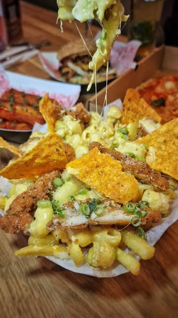 A montage-style video showcasing the various food and drink vendors at Platform Street Food in Cardiff Bay. The video features close-ups of burgers, pizza, loaded fries, cocktails, and gelato, alongside shots of the venue's interior and outdoor seating area.